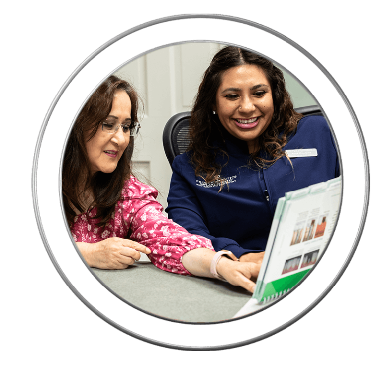 Patient talking with a dental assistant at J.P Prosthodontics in Fullerton, CA