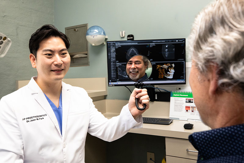 Dr. Joon Park and a smiling patient at J.P Prosthodontics in Fullerton, CA