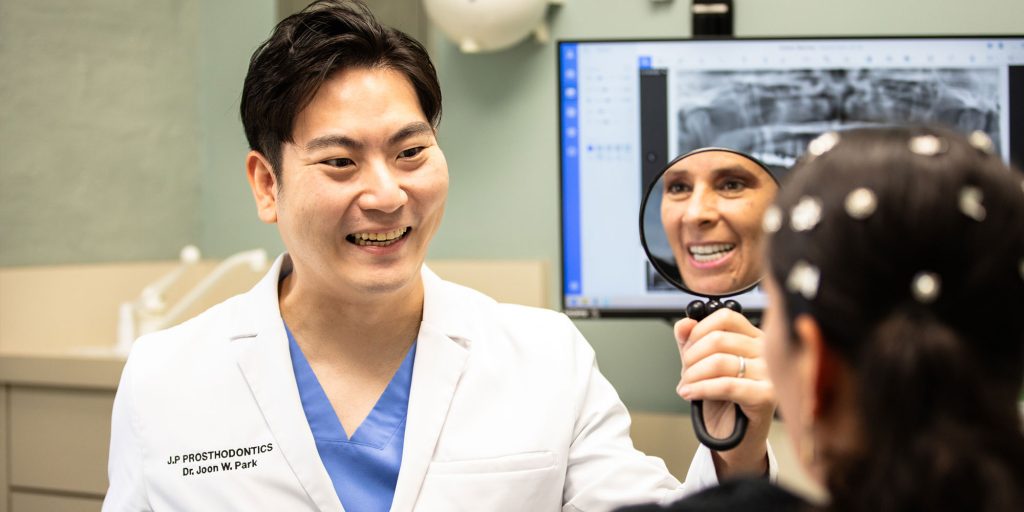 Dr. Joon Park and a smiling patient at J.P Prosthodontics in Fullerton, CA